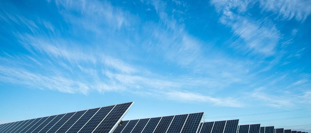 A ground-mounted solar plant under an open sky